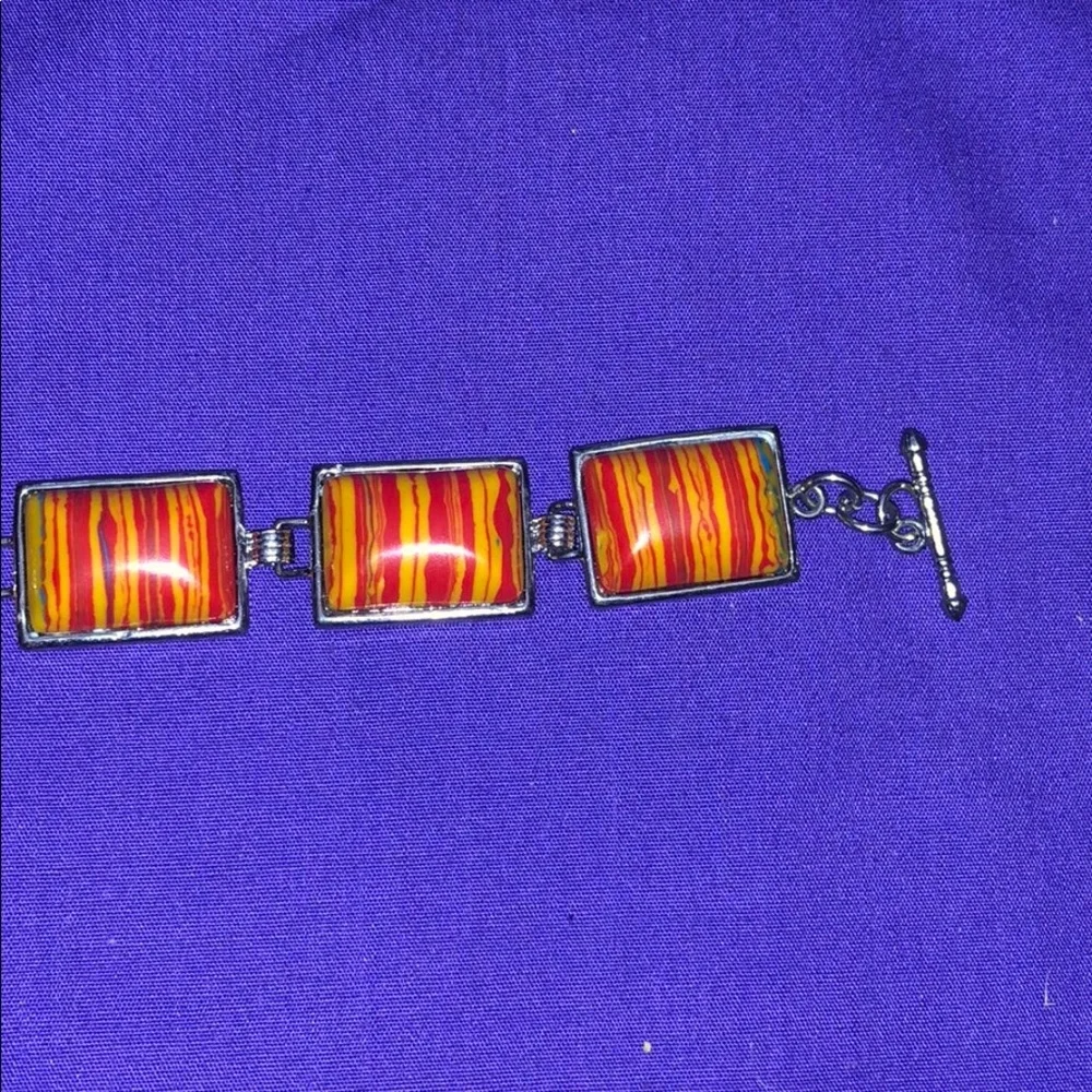 Orange resin‎ striped bracelet 8”